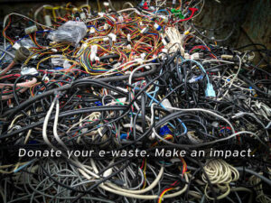 A large tangled heap of discarded electronic cables and wires, with overlaid text that reads, "Donate your e-waste. Make an impact." The image promotes electronic waste recycling.